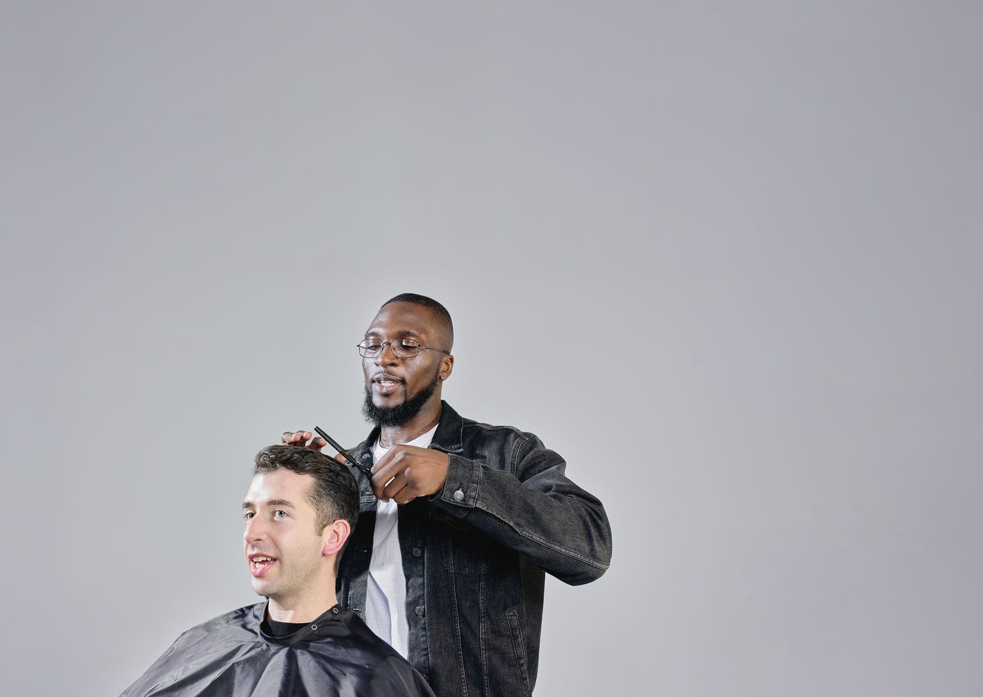 A barber at work in a Rudy's Barbershop location