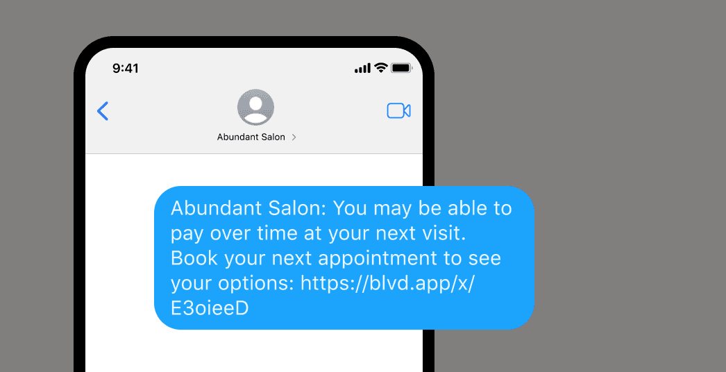 Phone mockup of an SMS from Abundant Salon promoting Boulevard Buy Now, Pay Later