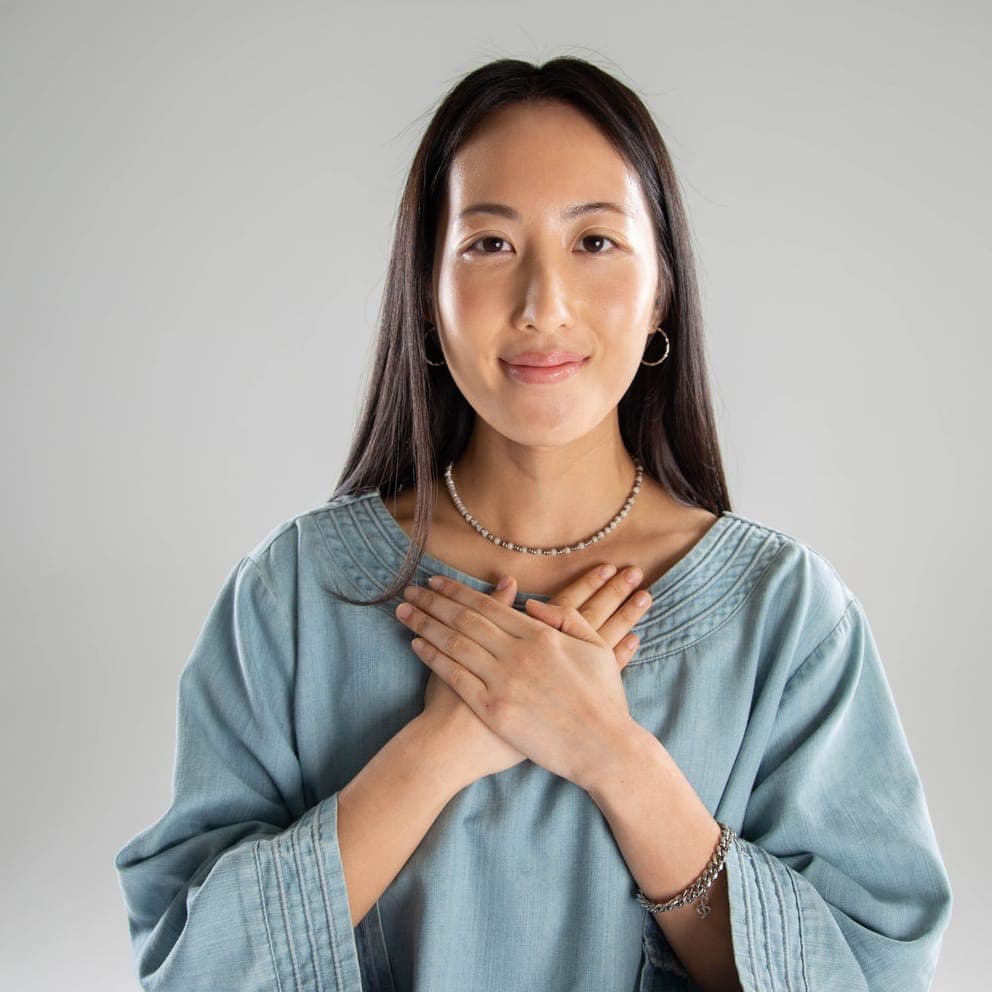 A Boulevard customer with her hands crossed over her heart