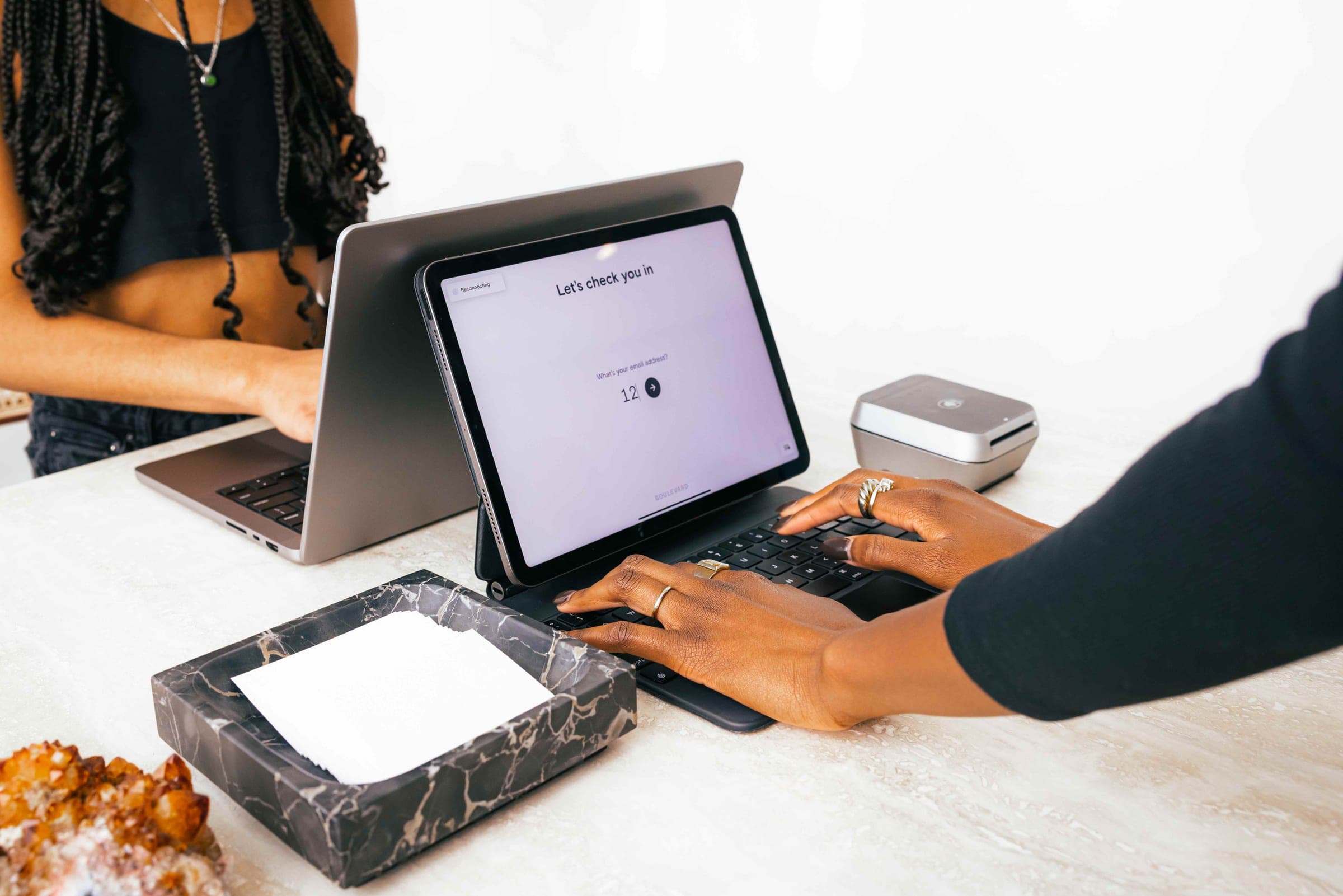Client checking in on a Boulevard self check-in screen at a medspa front desk