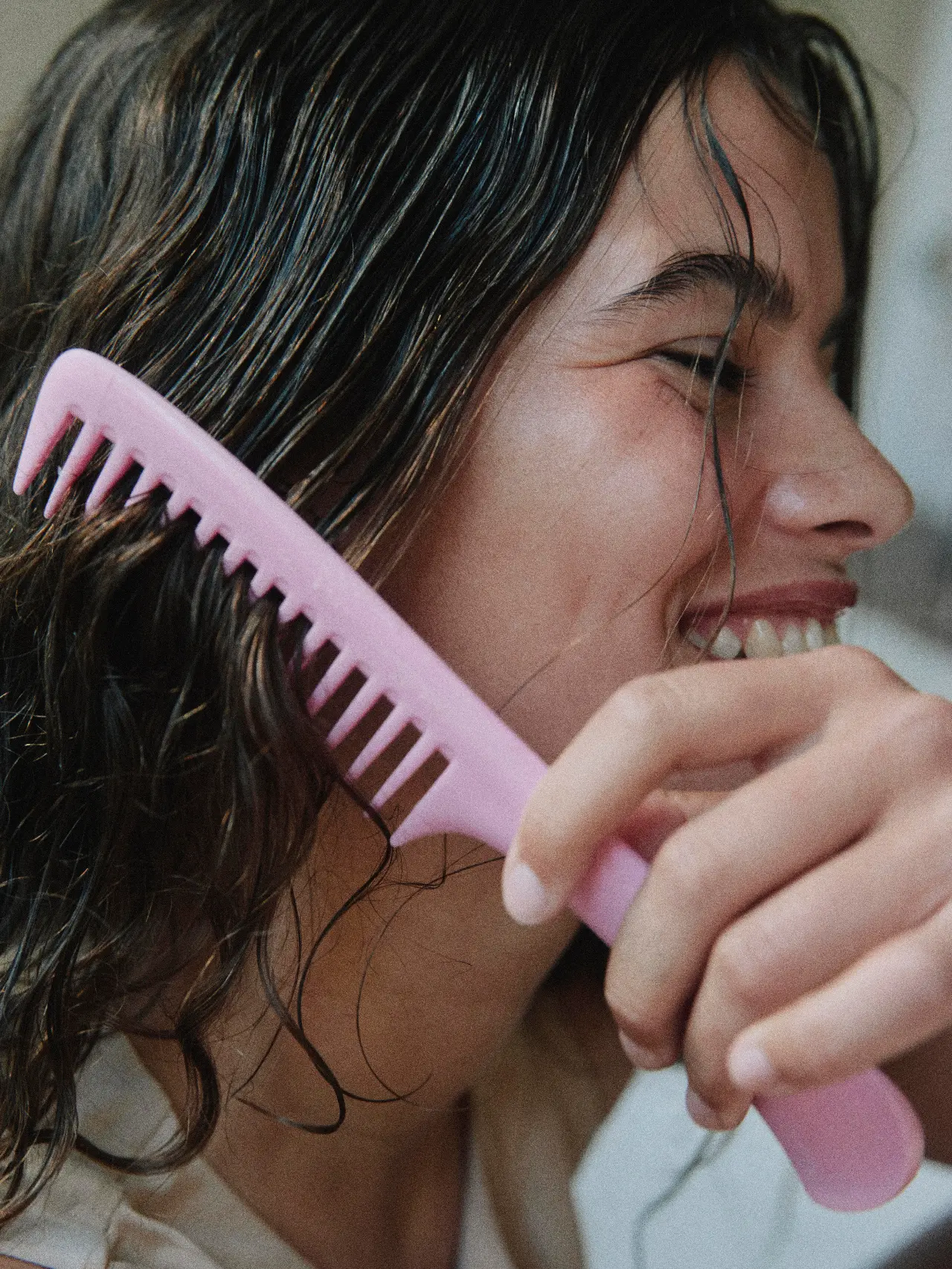 A client having her hair combed out at a salon appointment