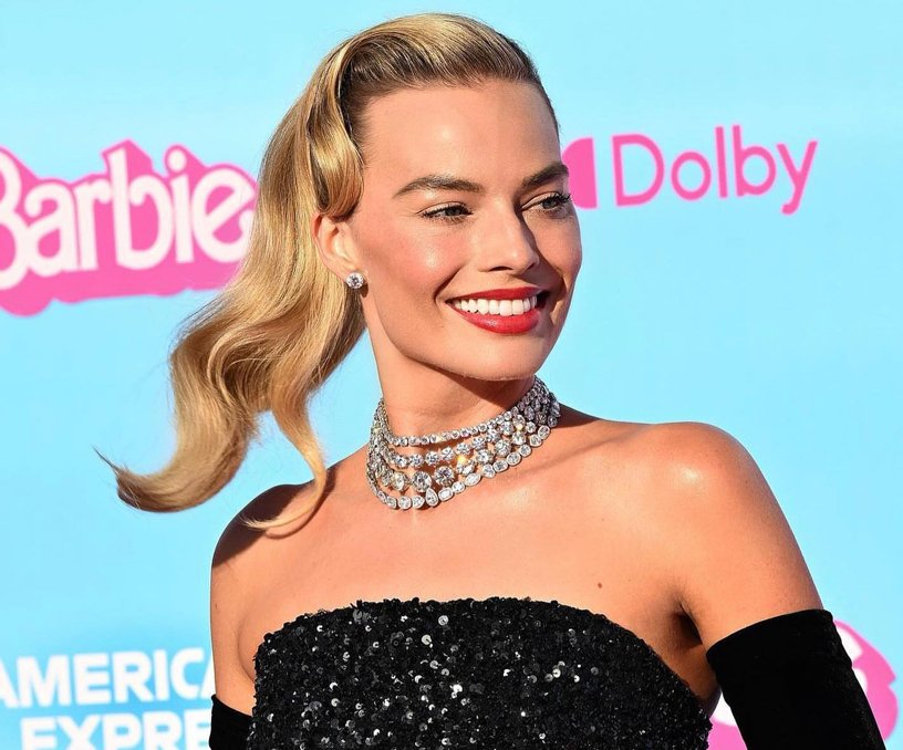 Margot Robbie poses for pictures on the Pink Carpet at the Barbie movie premiere in Los Angeles.