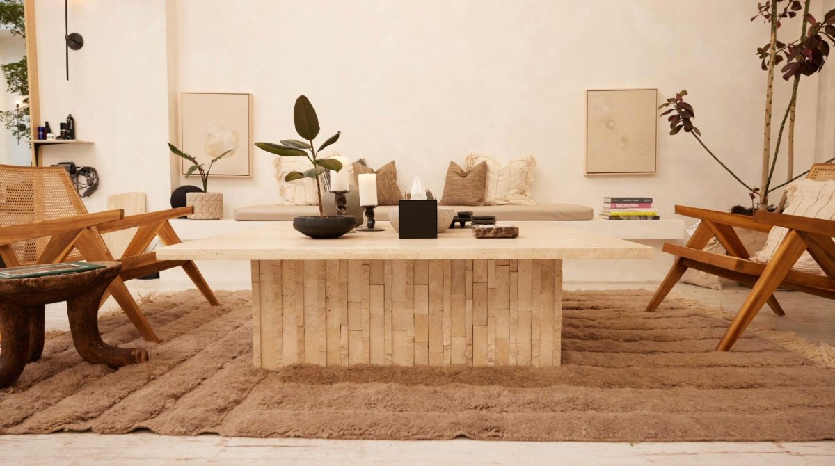 A beauty business lobby designed with natural wood furniture and colors.