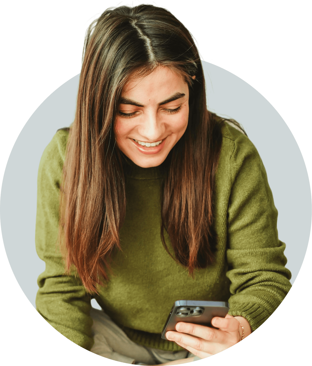 A woman smiles while looking at her smartphone. Text blocks show the contents of the messages on her screen; she's booking an appointment at a hair salon.